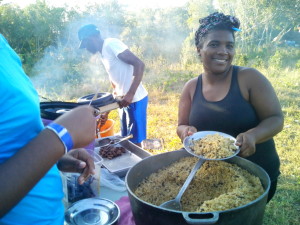 Mama Rosa serving the Moro de Guandules with Lionfish